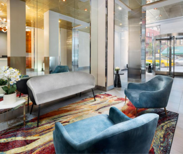 A Room With A Couch And Chairs